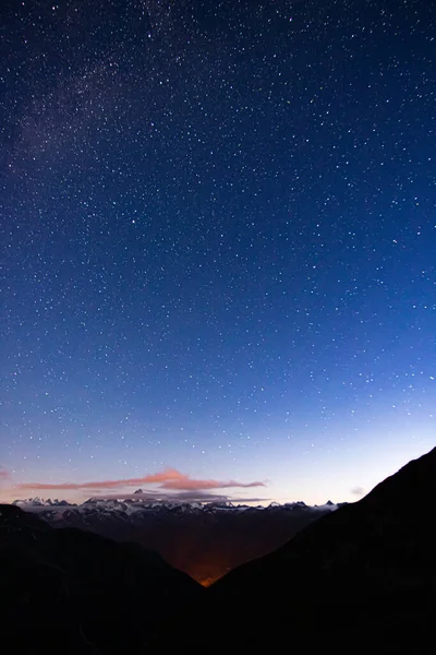 night landscape wtih star sky. Alps mountains in Switzerland