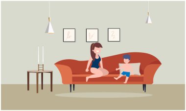 Bir odada oğluyla oturan bir kadın.