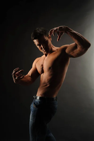 Sexy Man Flexes His Muscles — Stock Photo, Image