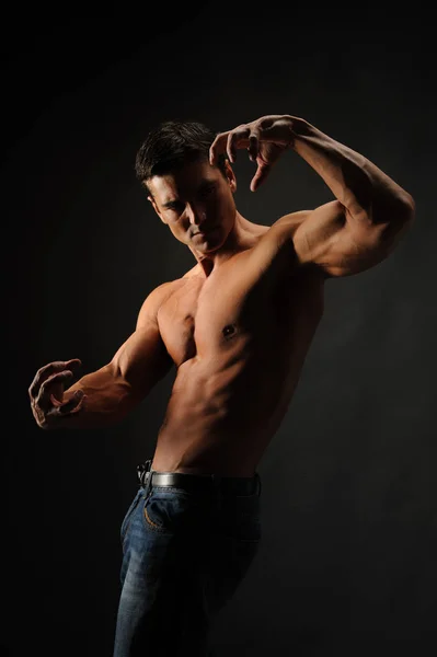 Sexy Man Flexes His Muscles — Stock Photo, Image