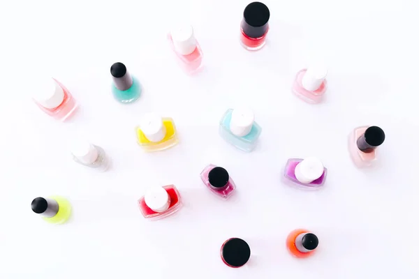 Group of nail polishes of different colors on white background — Stock Photo, Image