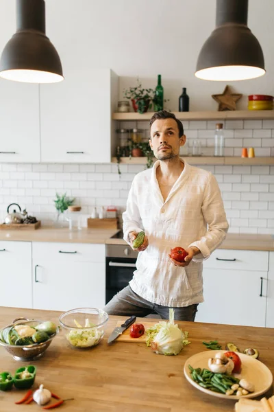 Picture of brunet cooking vegetables on table