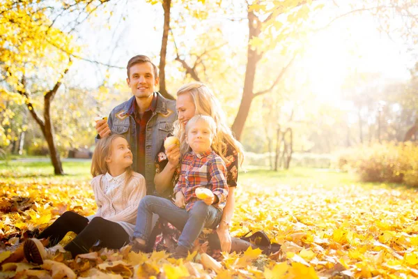 Image of happy family with son and daughter on walk in autumn park — Stock Photo, Image