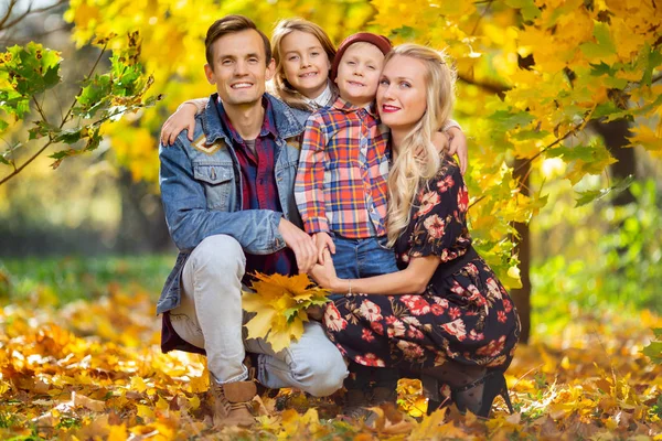 Photo of happy family with children on walk in autumn park — Stock Photo, Image