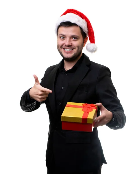 Immagine di bruna in cappello di Babbo Natale con dono in mano — Foto Stock