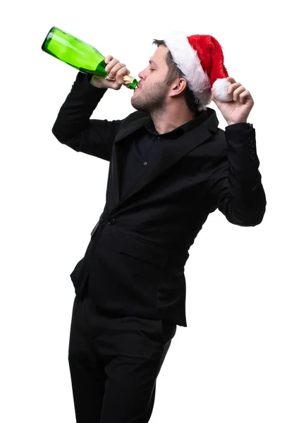 Foto de man in santa hat drinking from bottle — Foto de Stock
