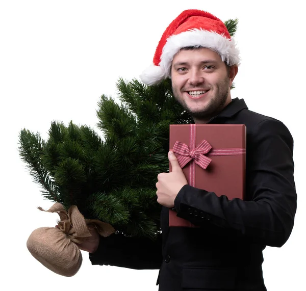 照片的人在圣诞老人帽子与圣诞树与箱子与礼物 — 图库照片