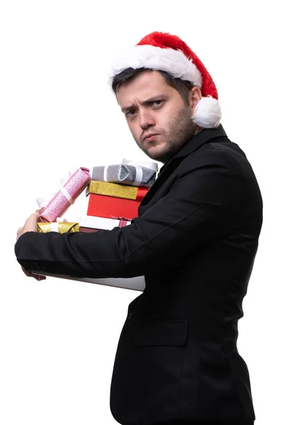 照片严重的布鲁内在圣诞老人帽子与礼物在手的箱子 — 图库照片