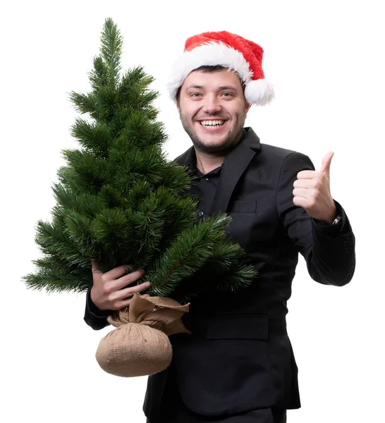 Foto de hombre en Santa hat con árbol de Navidad — Foto de Stock