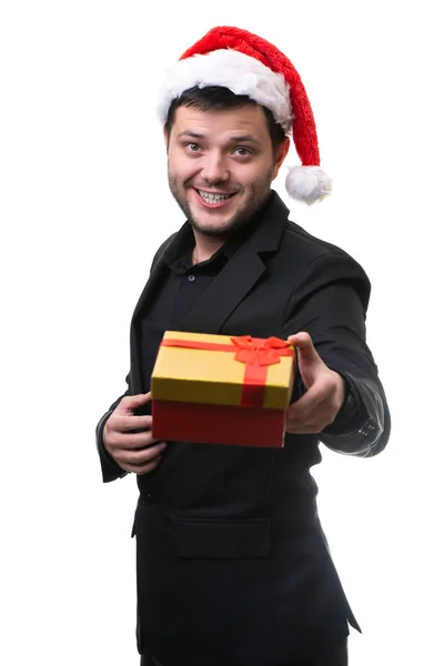 Foto dell'uomo a Babbo Natale con il regalo in mano — Foto Stock