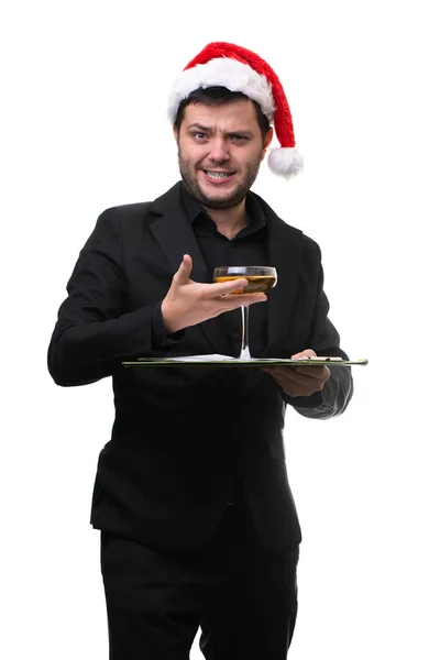 Imagen del hombre en sombrero de Santa con copa de champán y bandeja en las manos sobre fondo blanco — Foto de Stock