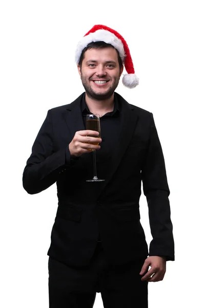 Foto de hombre feliz en sombrero de santa con copa de champán en sus manos — Foto de Stock