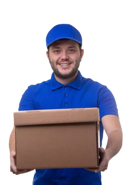 Image of smiling man in blue t-shirt and baseball cap with cardboard box — Stock Photo, Image
