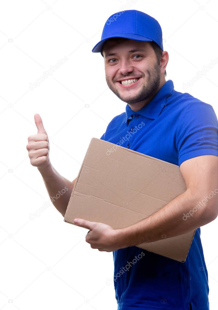Photo of young man in blue T-shirt and baseball cap with cardboard box