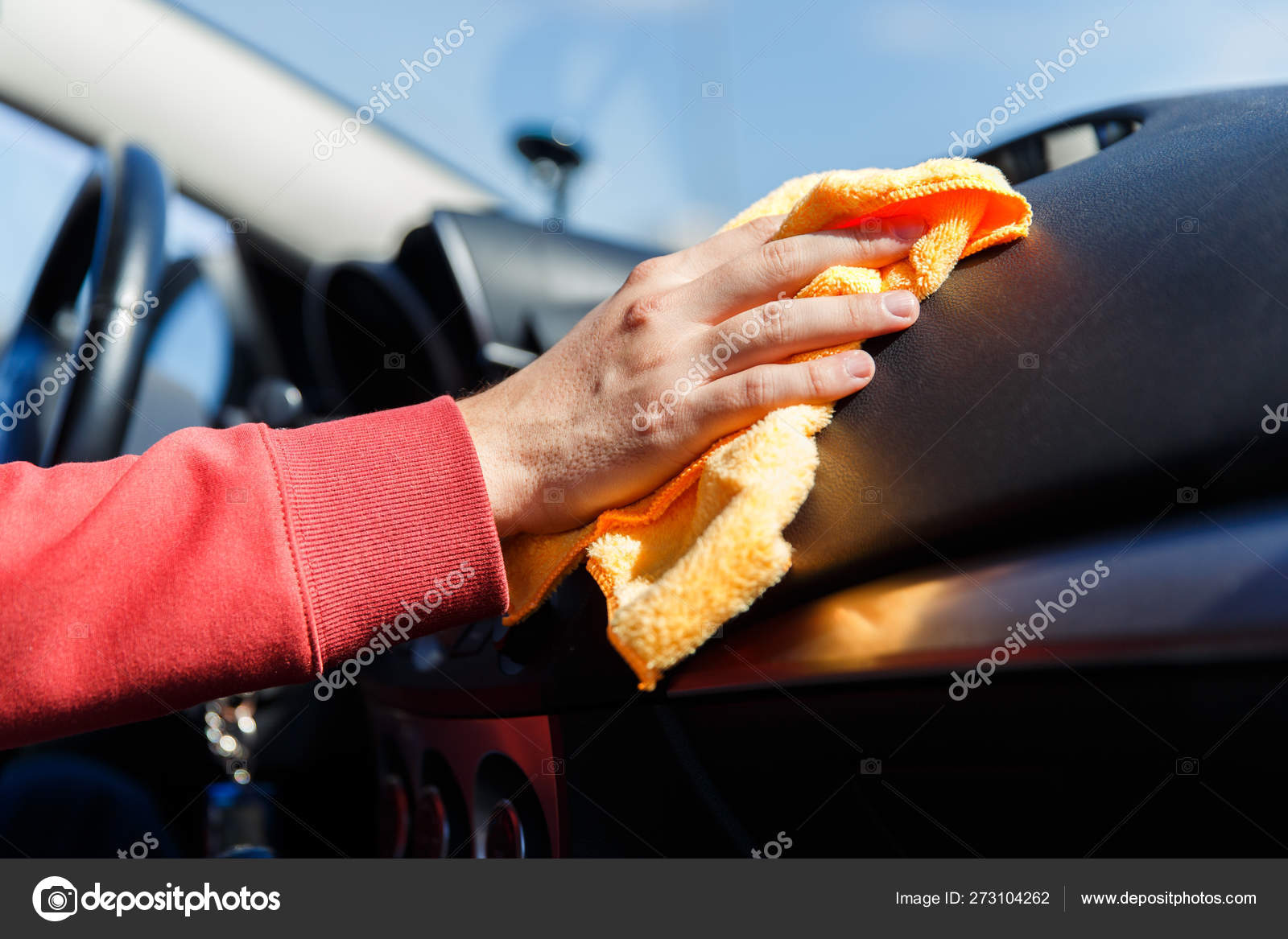 Photo Of Mans Hand With Orange Rag Washing Car Interior
