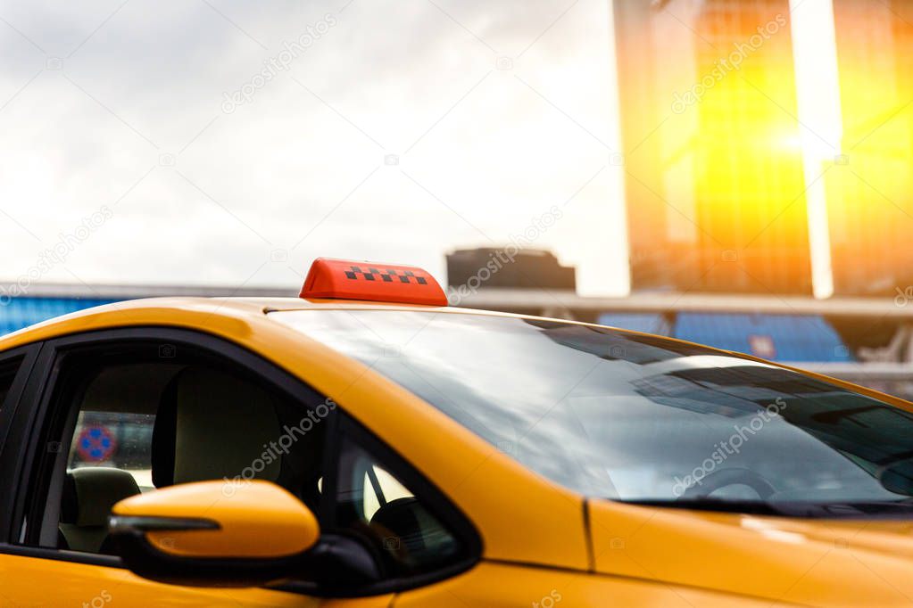 Close-up photo of yellow taxi in city
