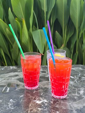 red and white cocktail on the table