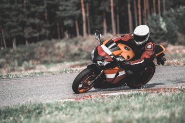 Fast Motorcycle road riding. having fun driving the empty highway on a motorbike tour journey. Black an White photo.
