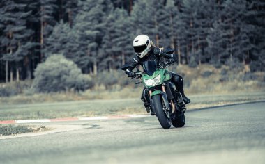 Fast Motorcycle road riding. having fun driving the empty highway on a motorbike tour journey. Black an White photo.