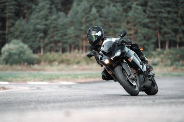 Fast Motorcycle road riding. having fun driving the empty highway on a motorbike tour journey. Black an White photo.
