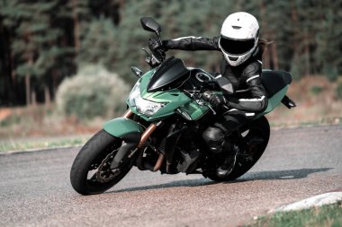 Fast Motorcycle road riding. having fun driving the empty highway on a motorbike tour journey. Black an White photo.