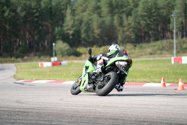 10-09-2020 Ropazi, Latvia Motorcyclist at sport bike rides by empty asphalt road. sport bike. Motorcyclist training.