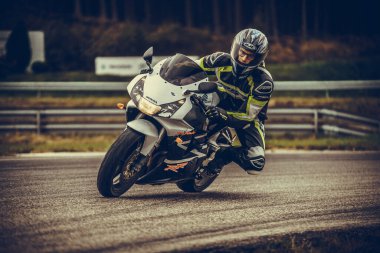 10-09-2020 Ropazi, Latvia Motorcyclist at sport bike rides by empty asphalt road. sport bike.