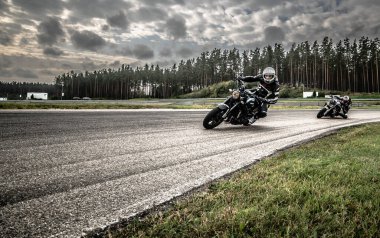 10-09-2020 Ropazi, Latvia Motorcyclist at sport bike rides by empty asphalt road. sport bike.