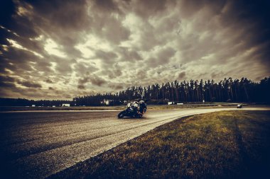 10-09-2020 Ropazi, Latvia Motorcyclist at sport bike rides by empty asphalt road. sport bike.