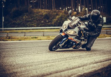 10-09-2020 Ropazi, Latvia Motorcyclist at sport bike rides by empty asphalt road. sport bike.