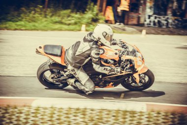 10-09-2020 Ropazi, Latvia Motorcyclist at sport bike rides by empty asphalt road. sport bike.