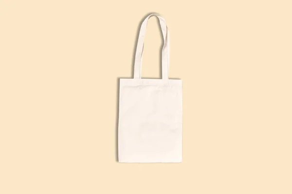 Shopping canvas or cotton bag on biege background. Mock-up for branding.
