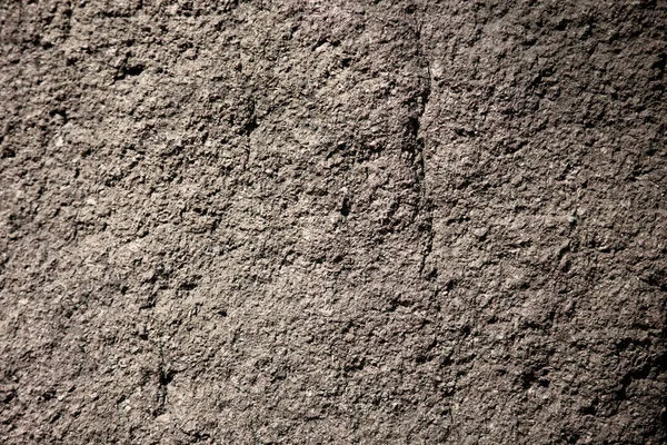 Cinza escabroso pedra natural ou fundo textura de rocha — Fotografia de Stock