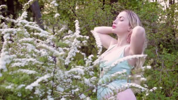 Young Woman Blonde Enjoys Spring Morning Flowered Garden — Stockvideo