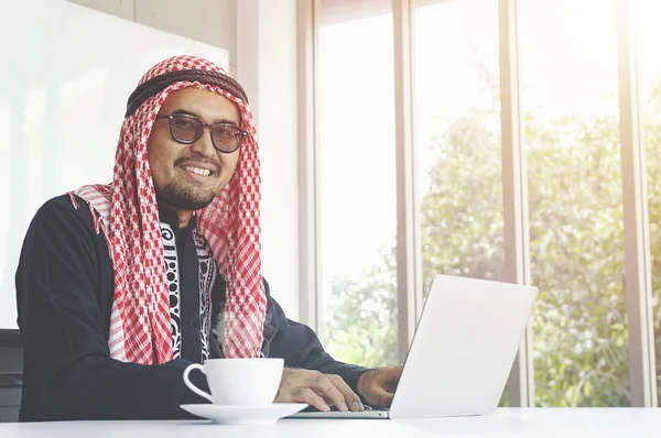 Arabian business man working on Laptop in the office - Image