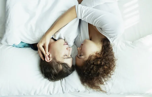 stock image Top view Young happy couple lying together