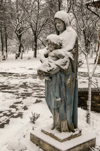 Ukraine. Winter view of St. Mary\'s sculpture with baby, Jesus Christ, in her hands