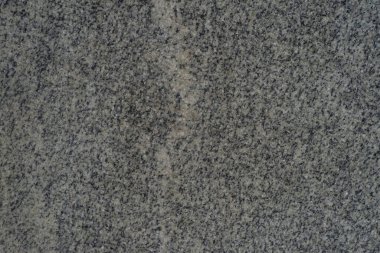Doğal gri granit arka plan. Maddesel granit dokuya bakıyor. Gri granitik arkaplan dokusu.