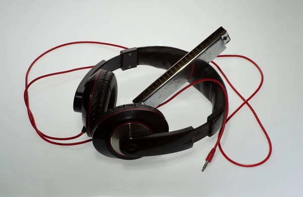 Stereo Headphones Listening Music Harmonica — Stock Photo, Image
