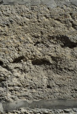 Kayanın arka planındaki eski duvarın dokusu..