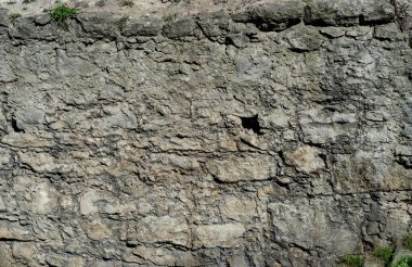 Kayanın arka planındaki eski duvarın dokusu..