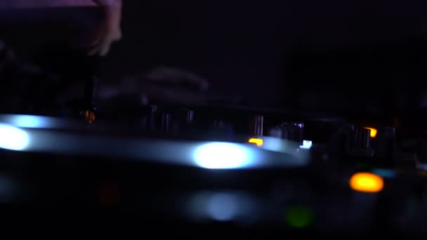 Dj Mixing music on turntable in night club, entertainment work, having fun party — стоковое видео