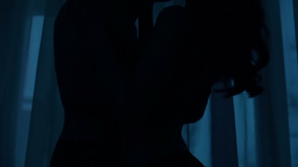 Young couple shadow hugging and kissing dark room, love and passion, closeness — Stock Video