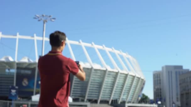 Hombre feliz besando boleto de fútbol, afortunado ganador de la lotería, emocionado antes del partido — Vídeo de stock