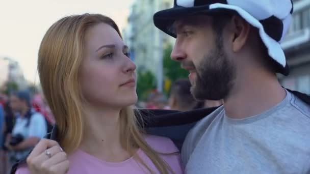 Germany football team supporters, couple in love hugging, holding German flag — Stock Video