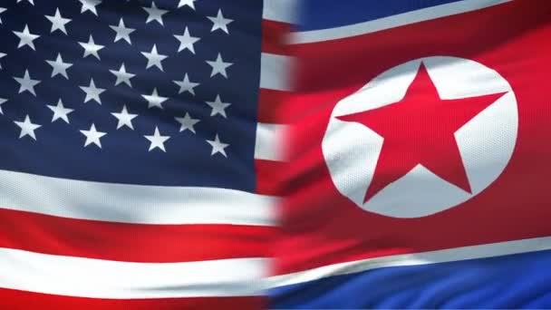 Estados Unidos y Corea del Norte apretón de manos, amistad internacional, fondo de la bandera — Vídeos de Stock