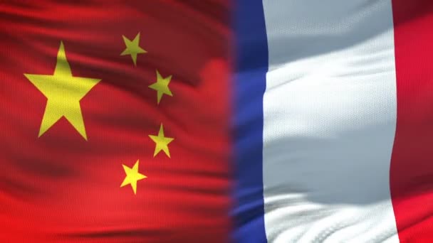 China y Francia apretón de manos, relaciones de amistad internacional, fondo de la bandera — Vídeos de Stock