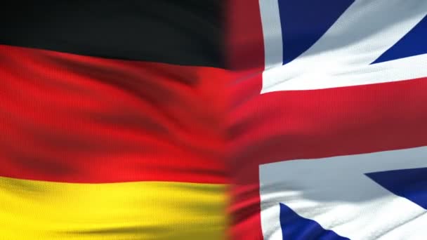 Deutschland und Großbritannien Händedruck, internationale Freundschaft, Fahnenhintergrund — Stockvideo