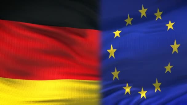 Duitsland en de Europese Unie handdruk, internationale vriendschap, vlag achtergrond — Stockvideo