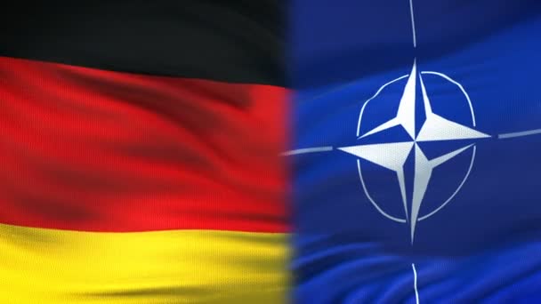 Bryssel, Belgien - Circa juni 2018: Tyskland och Nato handslag, internationella vänskap relationer, flagga bakgrund — Stockvideo